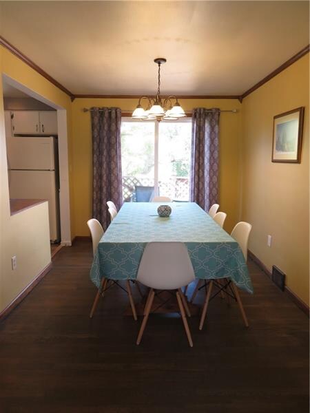 Dining room area with access to an outdoor deck.