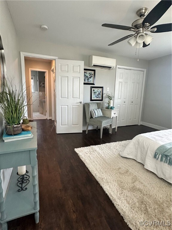 Bedroom featuring a closet, an AC wall unit, ceili