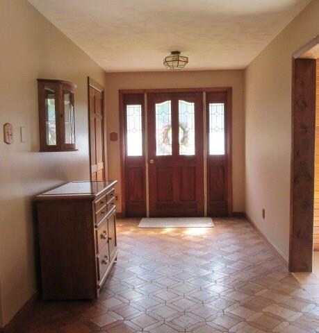 Step into the spacious foyer with hall closet and 