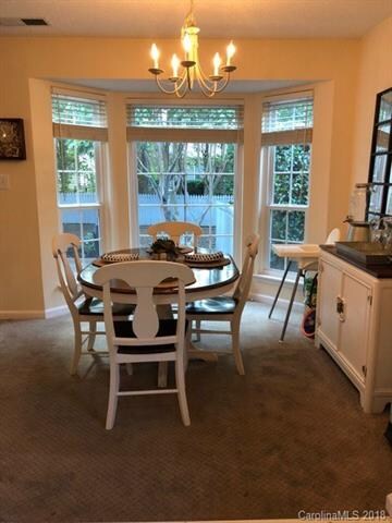 Dining area has a bay window overlooking the backy