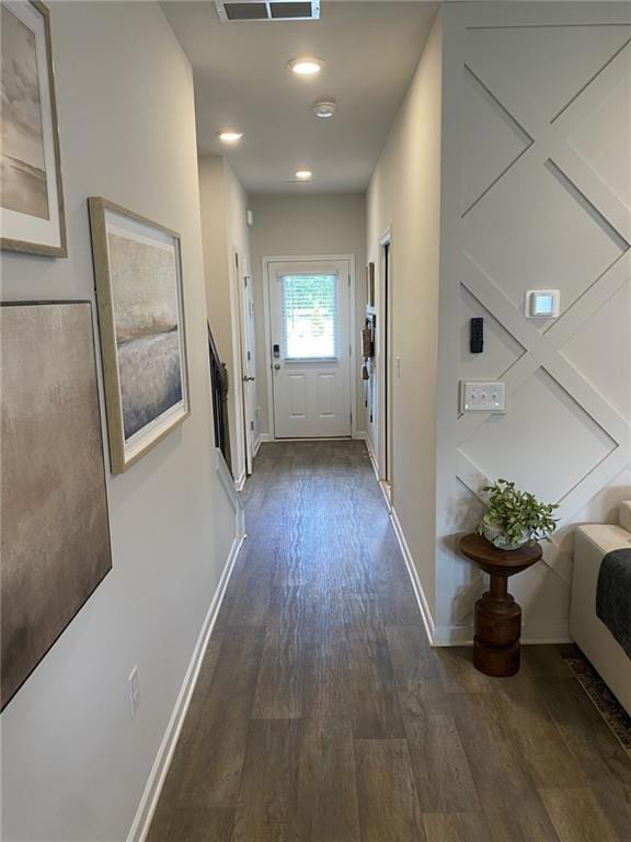 Hallway featuring dark wood-style flooring and recessed lighting