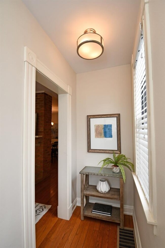 The bright entry greets you with hardwood floors.