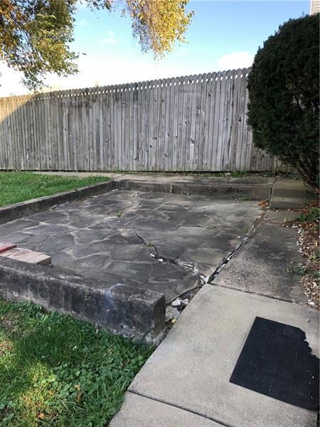 Nice patio in the back ready for your table and ch