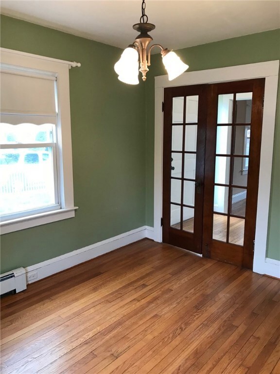 French doors off entry way leads into dining room