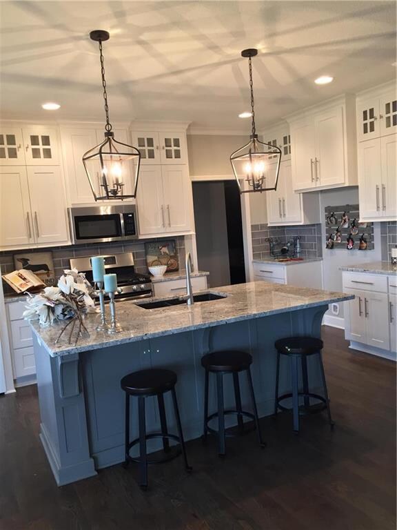 Beautiful Floor to Ceiling White Custom Cabinets. 