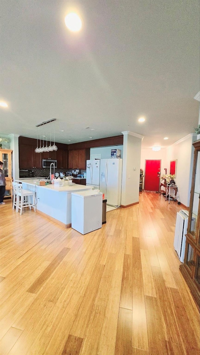 Kitchen featuring light countertops, white refrige
