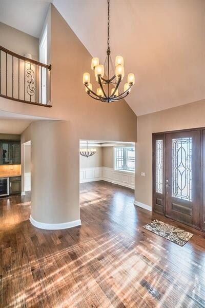 The Foyer features a 8' Mahogany leaded door & han