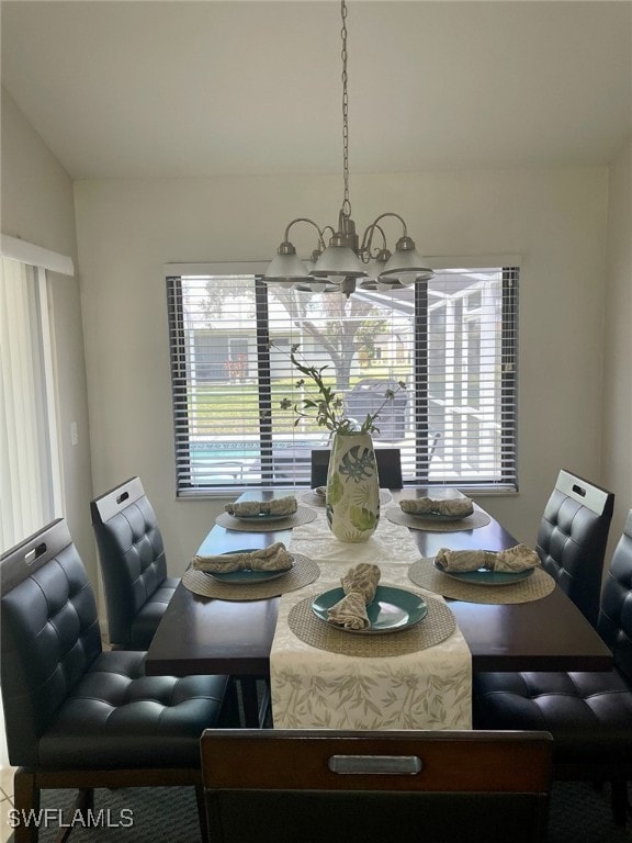 Dining room featuring a chandelier and plenty of n