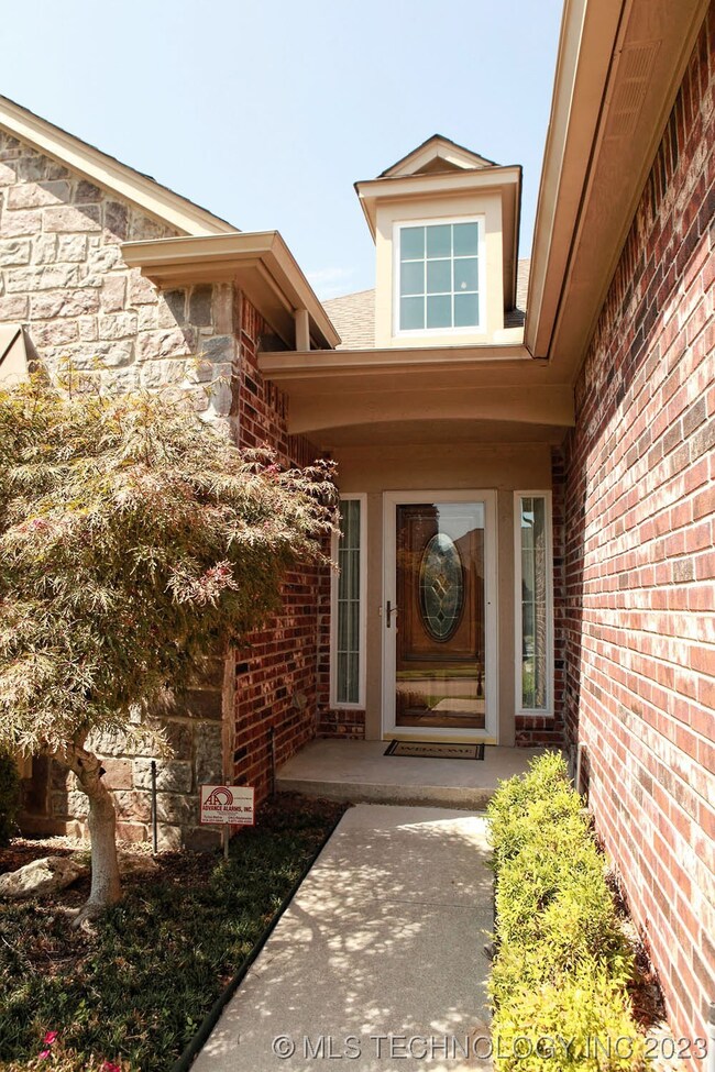 Welcoming walk way to the front door shows a dorme