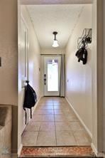 Doorway with tile patterned floors