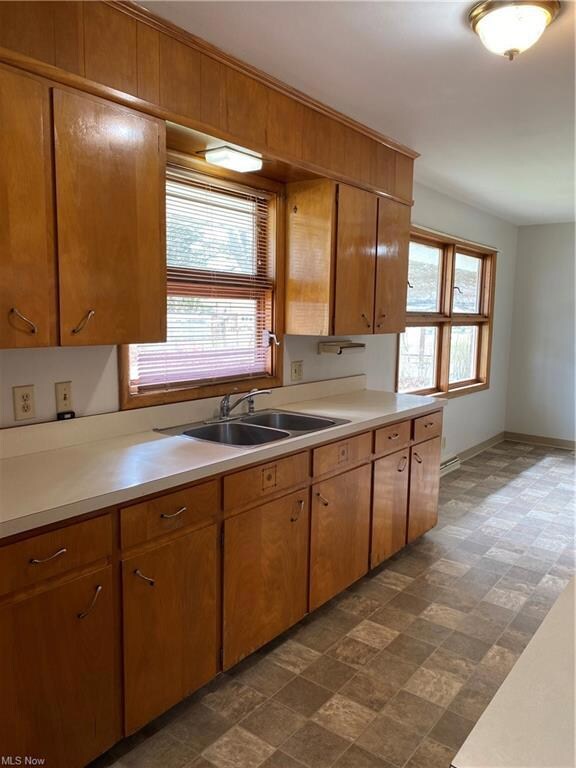 Kitchen 14 x7 with new vinyl flooring, faucet and 