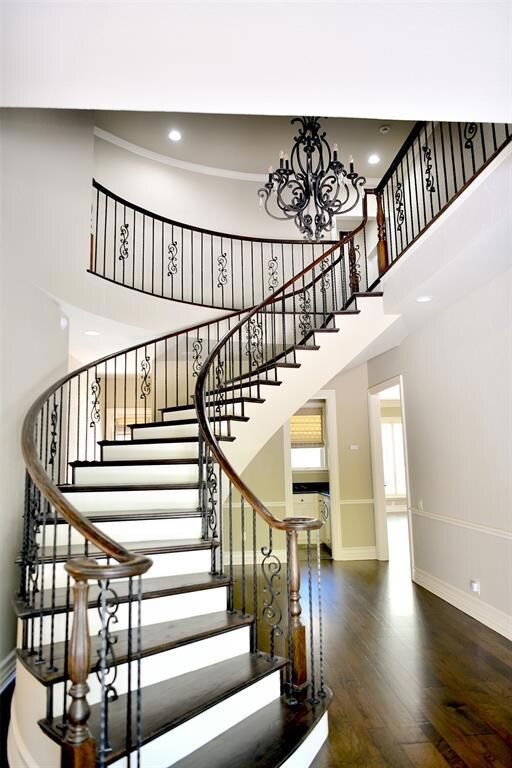 Grand sweeping staircase adorns the entryway