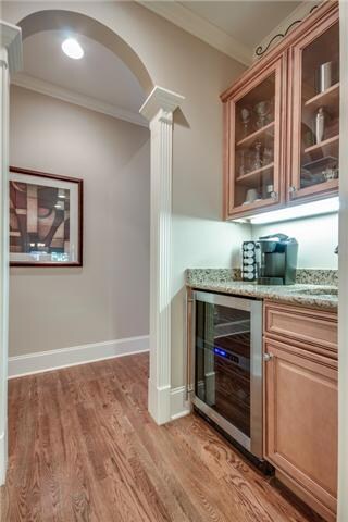 The Butler’s Pantry has a sink & wine refrigerator, and provides additional kitchen storage as well as the 2 pantries.