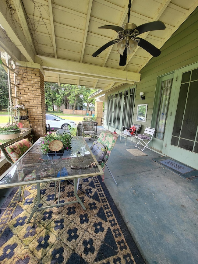 View of patio / terrace featuring outdoor dining area and ceiling fan