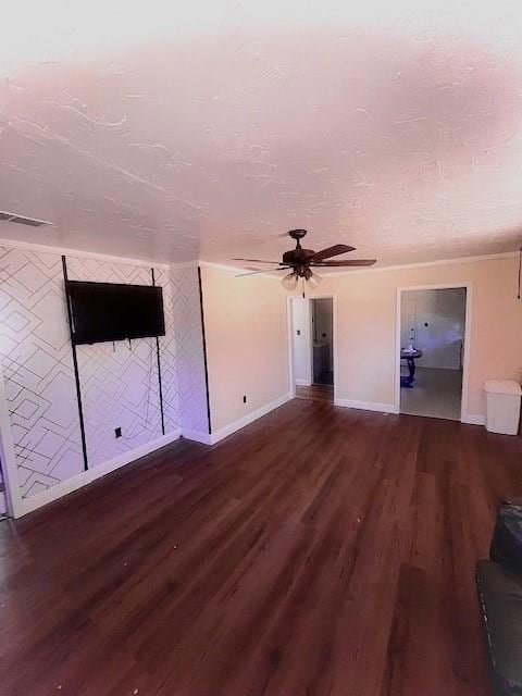 Unfurnished living room featuring ceiling fan and 