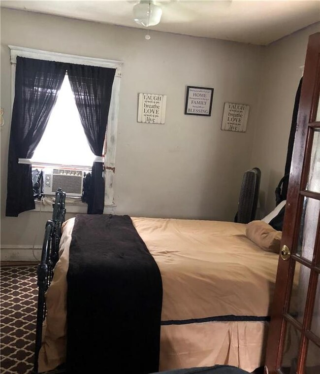 Enter french doors to discover Large Bedroom one!