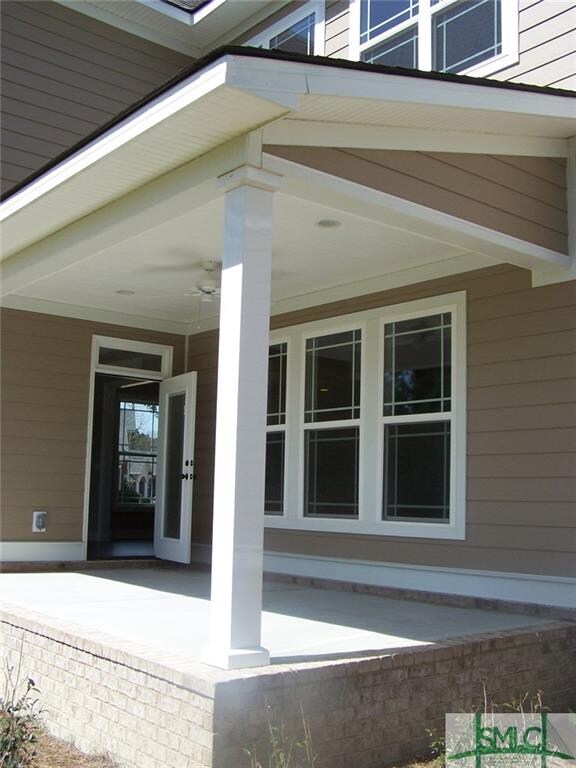 Covered rear porch leads into the keeping room of 