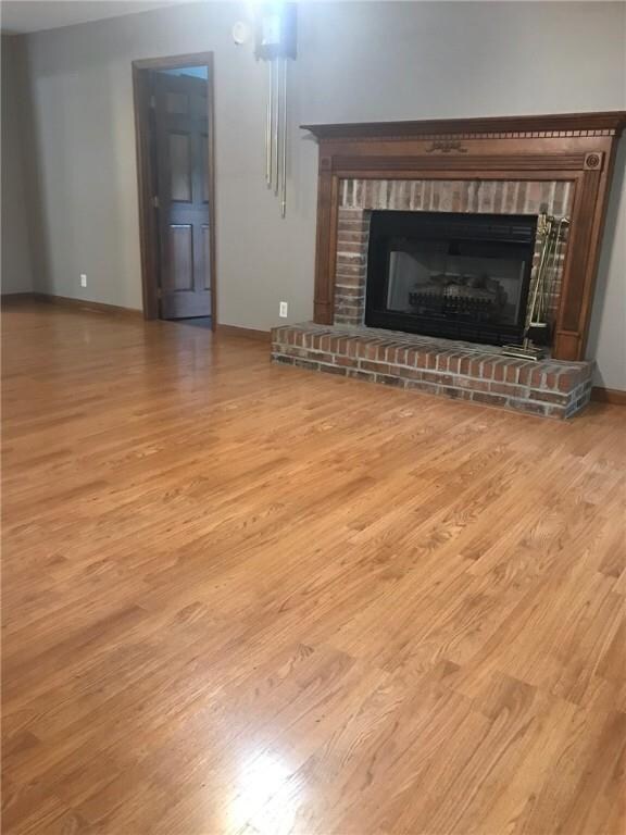 View in family den with the brick fireplace and ha