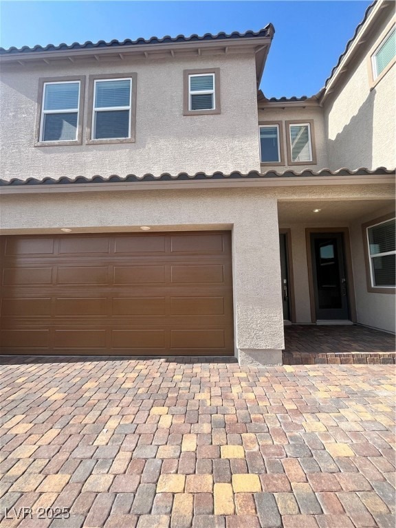 Multi unit property featuring stucco siding, an at