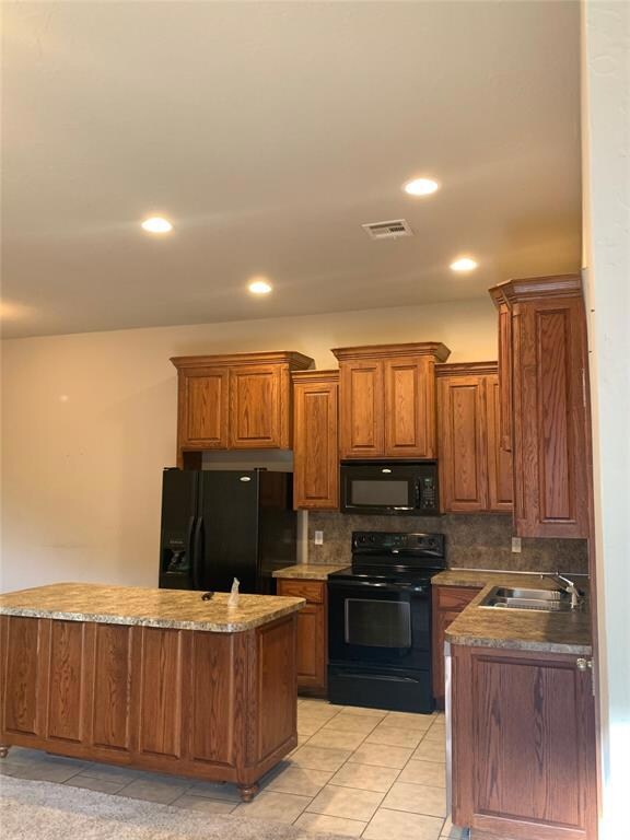 Kitchen featuring light tile patterned flooring, b