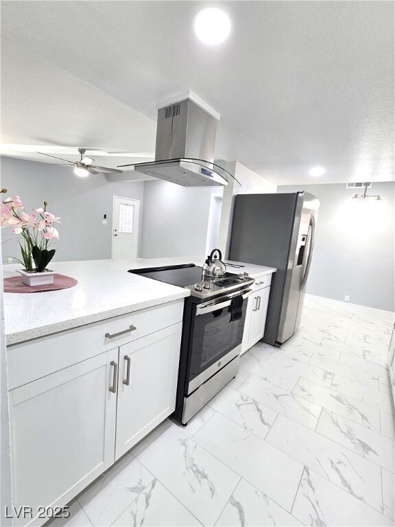 Kitchen featuring ceiling fan, marble finish floor