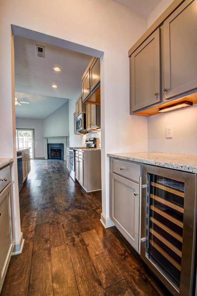 Butler's Pantry features a Wine Cooler. Picture of a Similar unit.