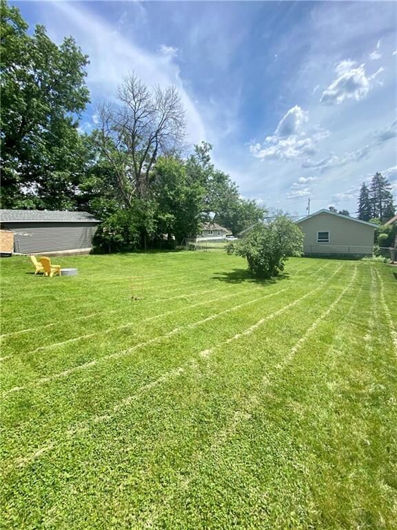 very large back yard partially fenced.