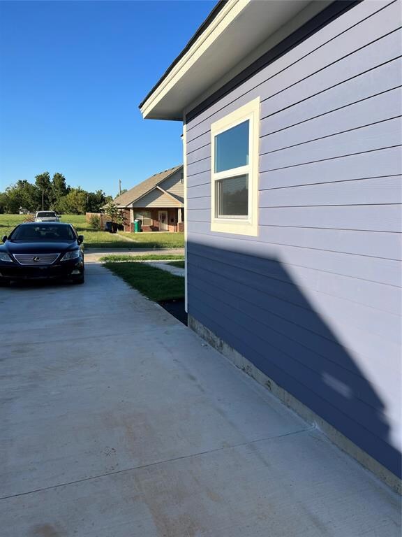 Extra long concrete driveway allowing access to th