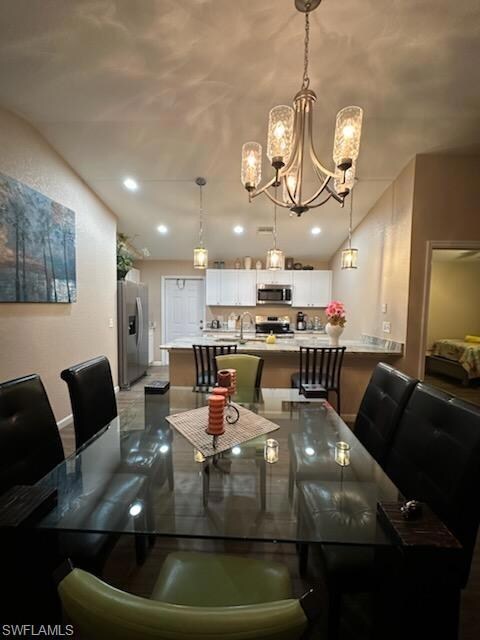 Dining area with a notable chandelier and sink