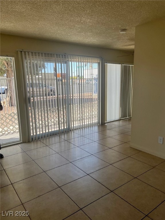 Tiled empty room with healthy amount of natural li