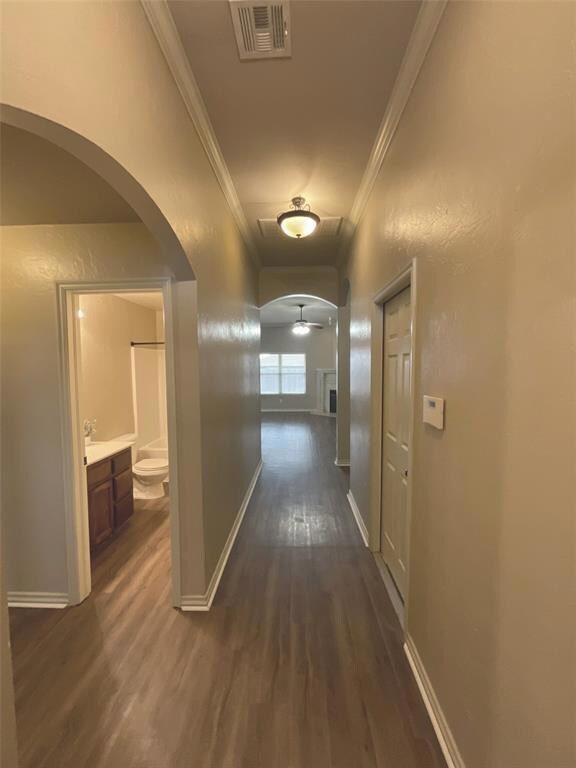 Hall with dark hardwood / wood-style floors