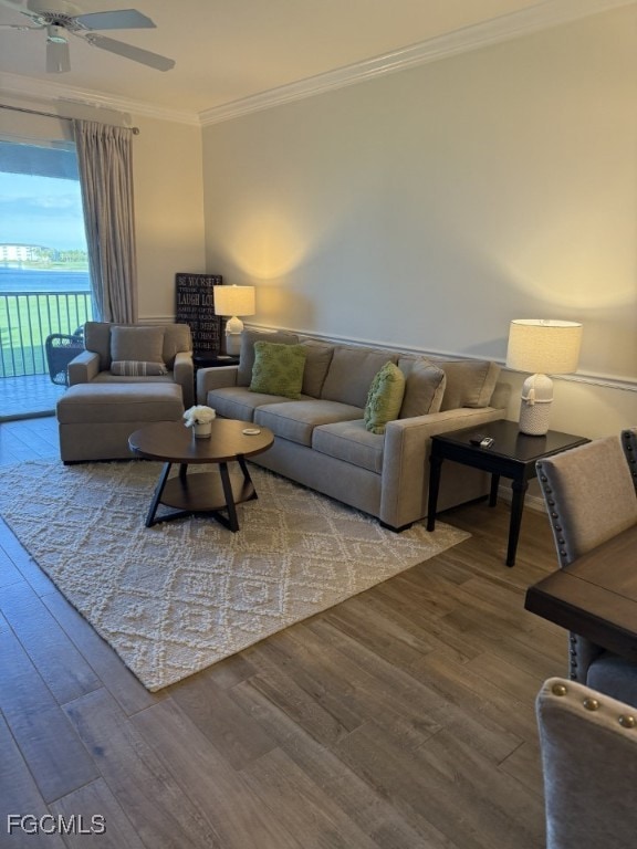 Living area with wood finished floors, crown molding, and ceiling fan