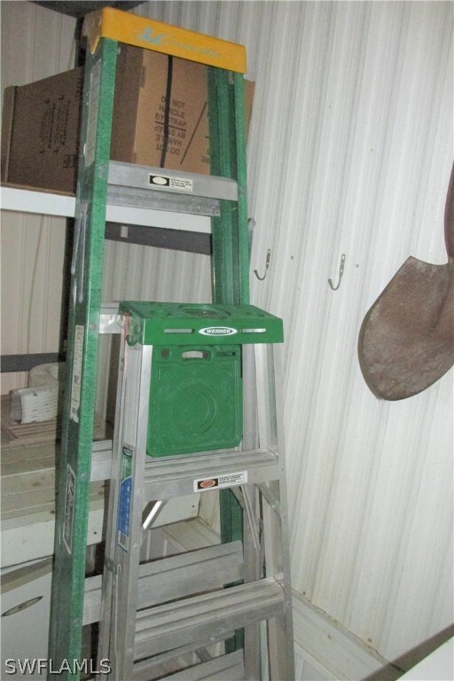 Laundry/utility storage with small fridge and free