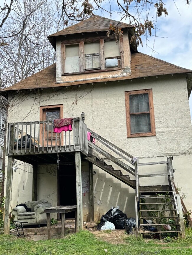 The upstairs deck is off the kitchen door. The exterior door to the basement is under the deck
