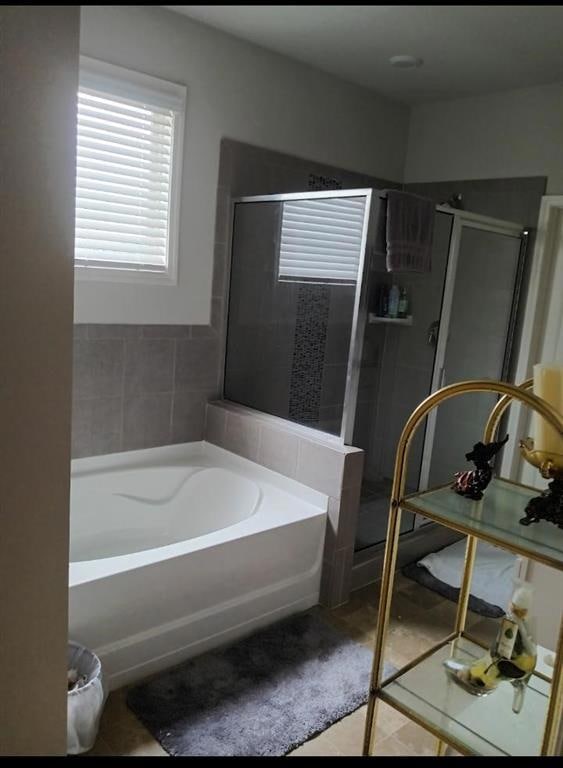 Bathroom featuring tile patterned flooring and ind