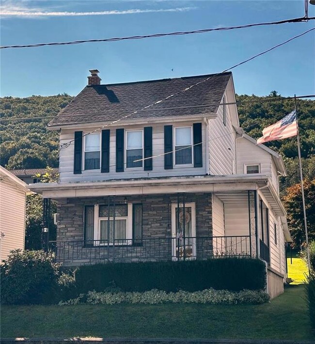 Large covered concrete front porch