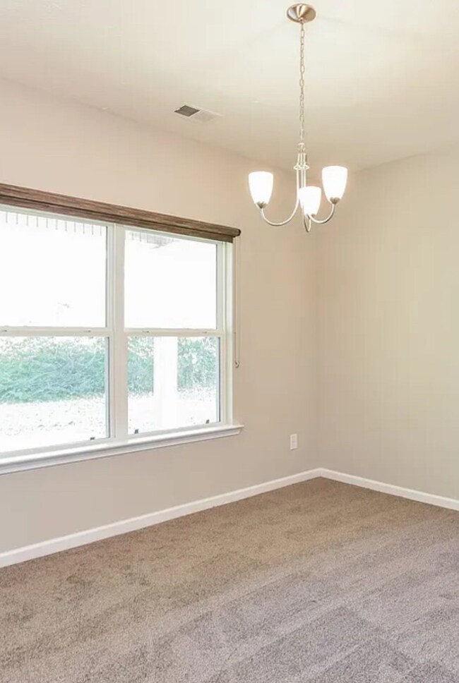 This room is just off the downstairs hallway. The large half bath is beside it. It could be an office or Rec Room area