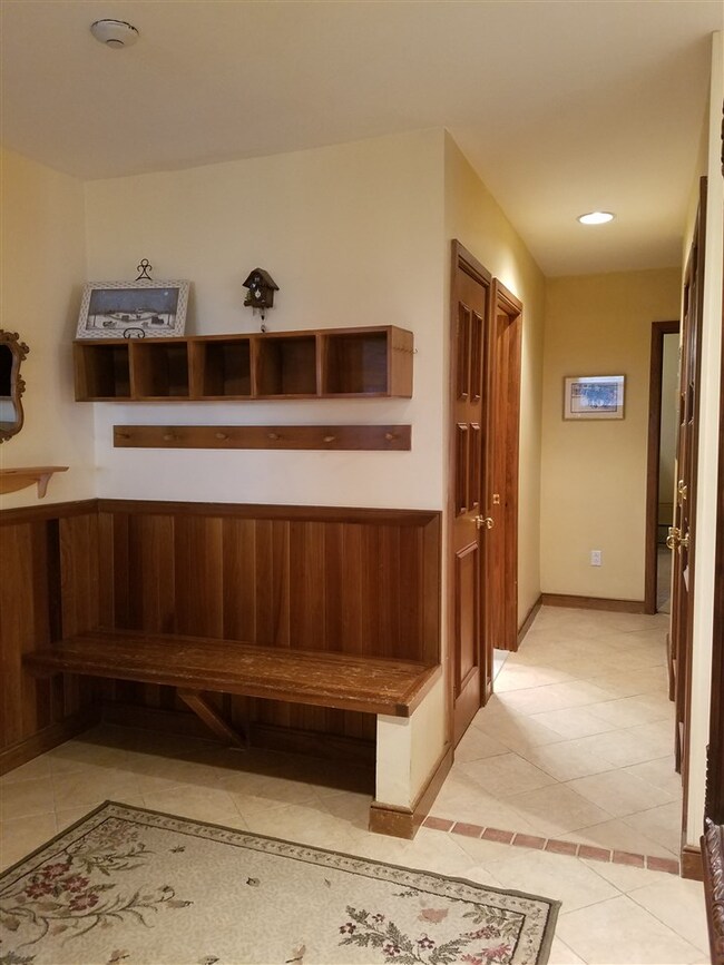 New tiles, bench and cubbies just inside the door.