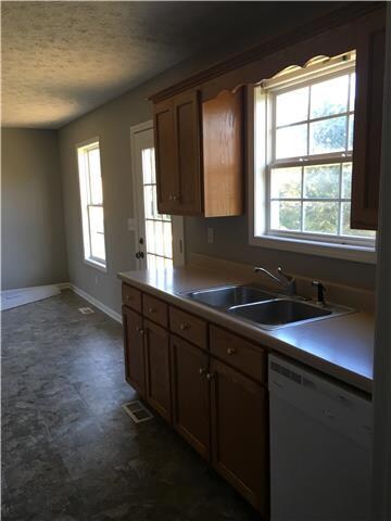 Kitchen offers window over sink and private entrance to back deck! 