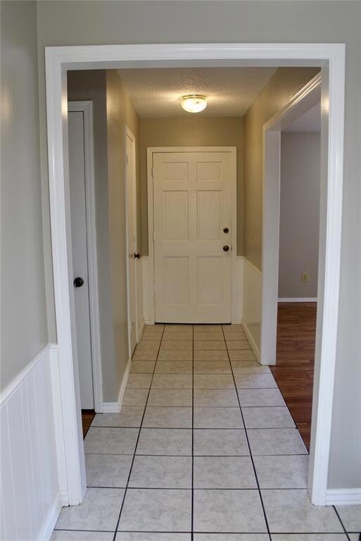 Entry way with closet and tiled floors