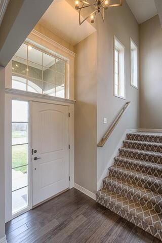 Beautiful gleaming dark hardwoods greet you at the