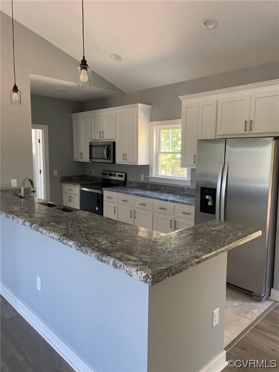 Kitchen with appliances with stainless steel finis