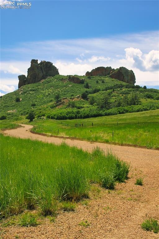 View of mountain backdrop featuring rural landscape