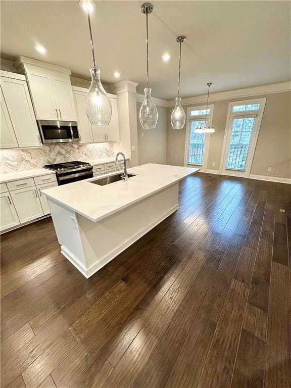Kitchen featuring a sink, decorative backsplash, d