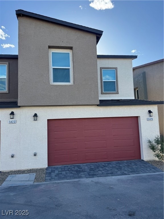 View of front of home with an attached garage and