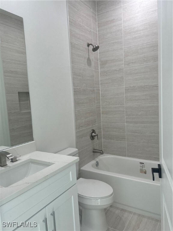 Full bathroom featuring vanity, tiled shower / bat