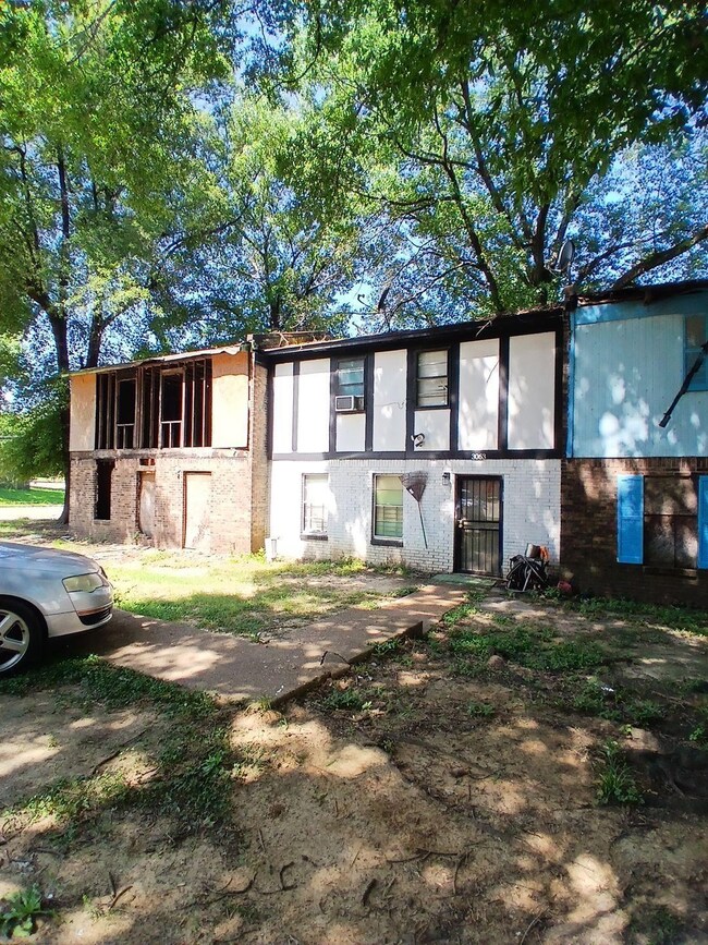 View of front of home with brick siding and stucco siding