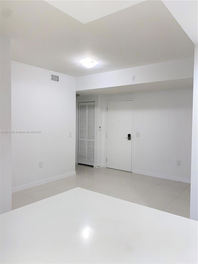 POV Kitchen Island to Dining Area, Entrance, and 1/2 Bath