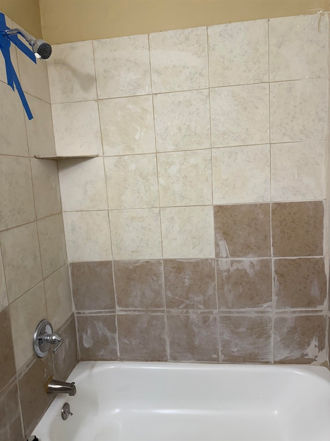 Full bathroom with  shower combination