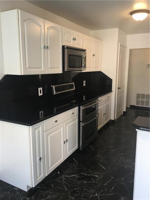 Kitchen with Marble counter Tops